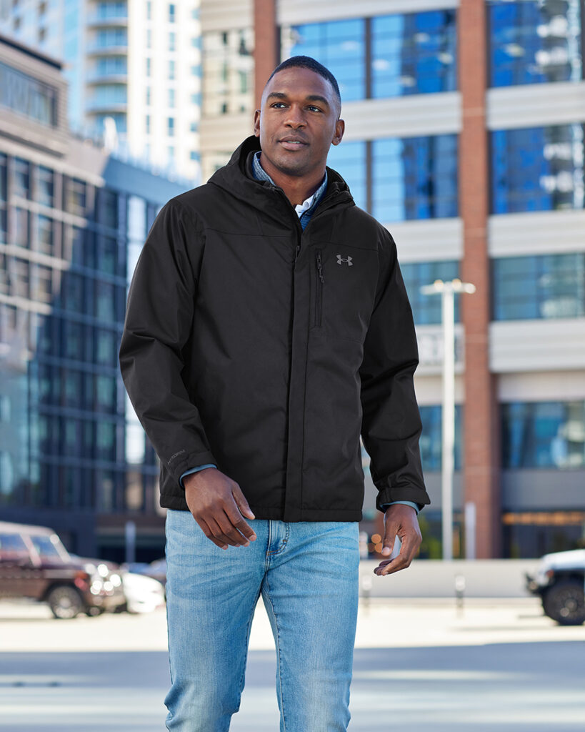 A man walking in an Underarmor jacket