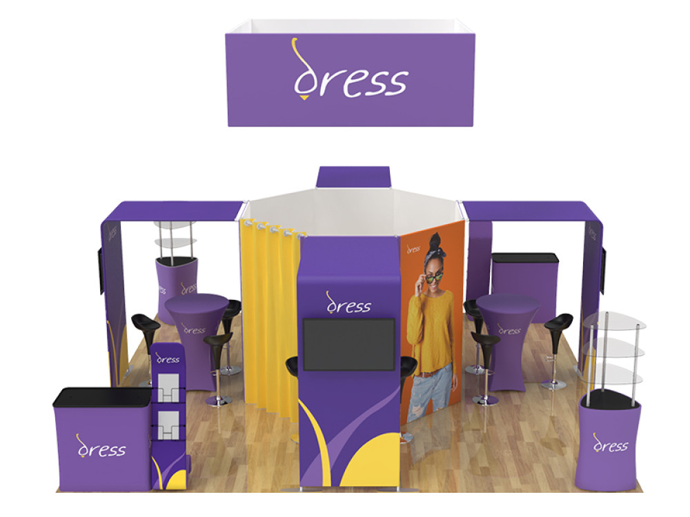 A tradeshow display with circular signage, high tops and chairs.