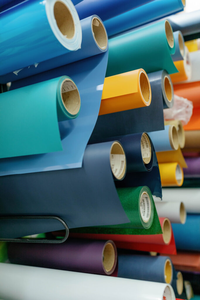 A picture of multiple paper rolls in different colors.