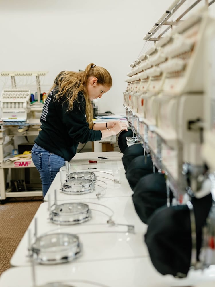 An IDX employee working on our in-house manufacturing line.